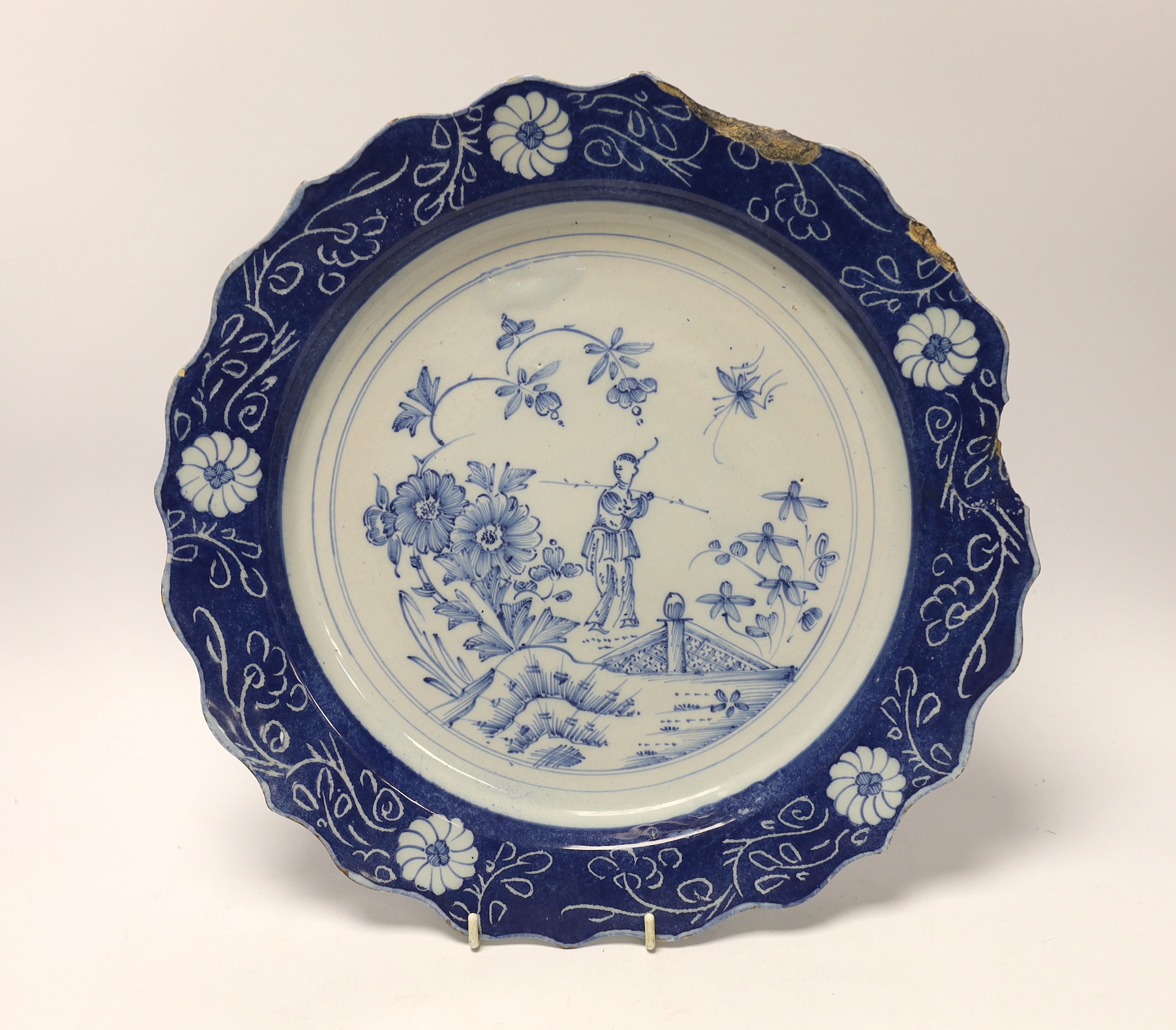 An 18th century Lambeth delftware charger, 34cm in diameter